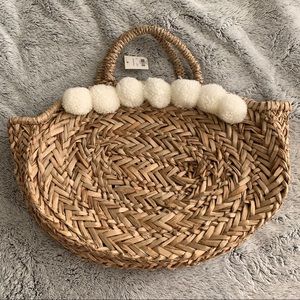 Francesca’s woven pompom purse
